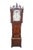 An exceptional early 19th century English George III grandfather clock. Features a beautiful flame mahogany case featuring...