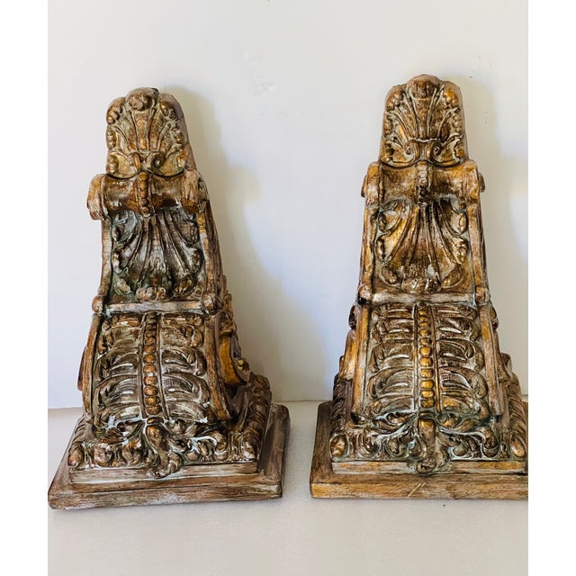 Gorgeous pair of vintage sculptural pair of brackets with distressed finish.