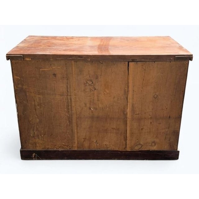 This item is an antique French Empire style commode (chest of drawers), a classic example of early 19th-century European...