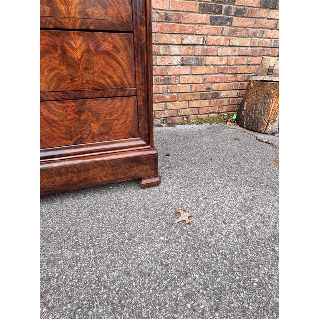 This magnificent French chest is the epitome of everything the Louis Philippe style stands for! The front is a show...