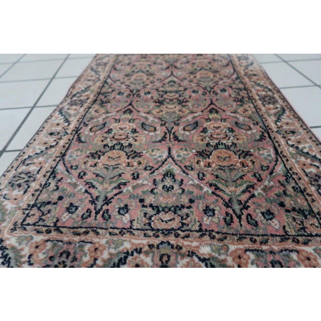 Introducing our exquisite Handmade Vintage Persian Kerman Rug from the 1950s. This charming rug features a compact size of...