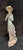 Lladró "Reading" porcelain figurine (also known by its Spanish name, "De Paseo y Lectura") The piece depicts an elegant...