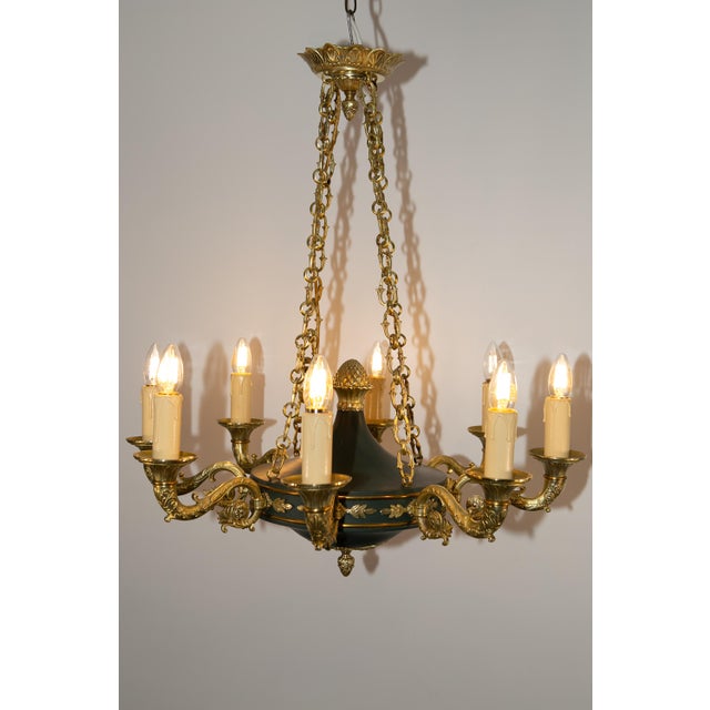 Restored chandelier in the Empire style, from France around 1930. The chandelier is in very good condition considering its...