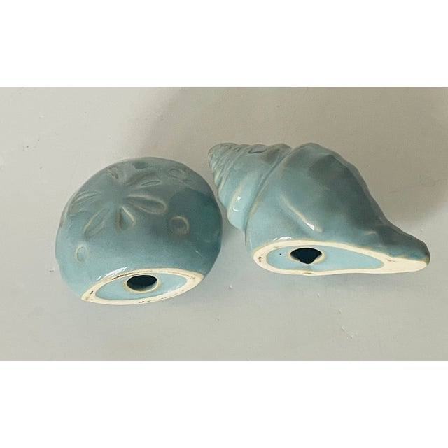 Vintage ceramic pair of ceramic sea shells salt and pepper shakers.