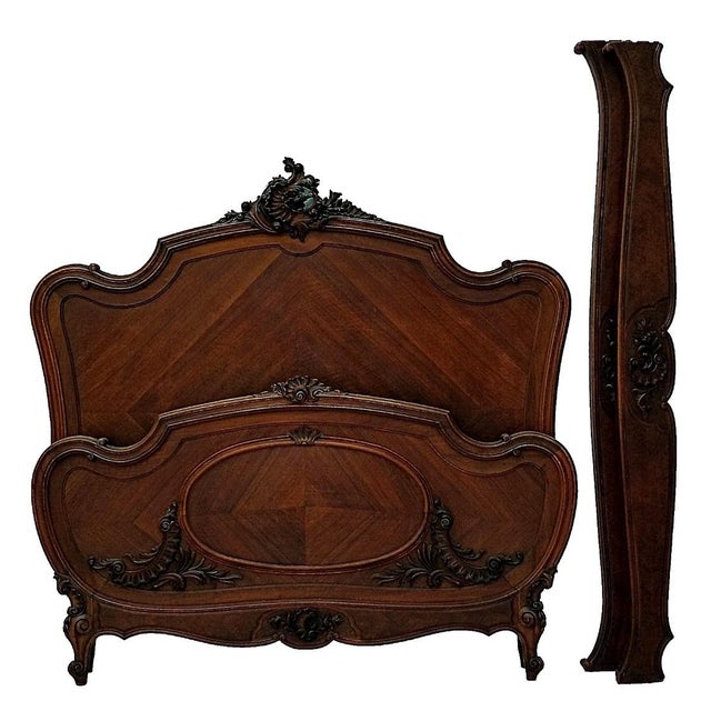Elevate your bedroom with the timeless elegance of this Antique French Louis XV Revival Walnut Bed Frame, a superb example...