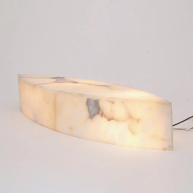 H: 59cm w: 18.5cm d: 10.5cm. An american 1970s alabaster wall light with curved sides and pointed ends. up to 250v...