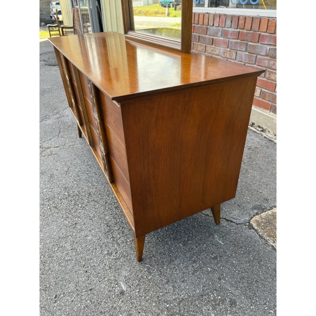 Interesting and sought after mid-century six drawer dresser by Bassett. Part of the "Mayan" collection, this dresser...