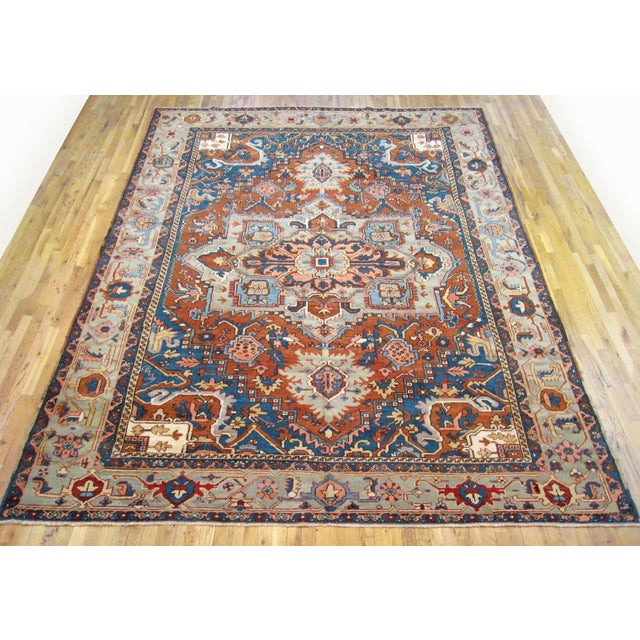 Antique Persian Heriz oriental rug, room size An antique Persian Heriz oriental rug, size 12'4" x 9'0", circa 1910. This...