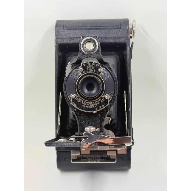 Overview: Elevate your bookshelf, executive desk, or gallery display with this exceptional antique Eastman Kodak No.2...