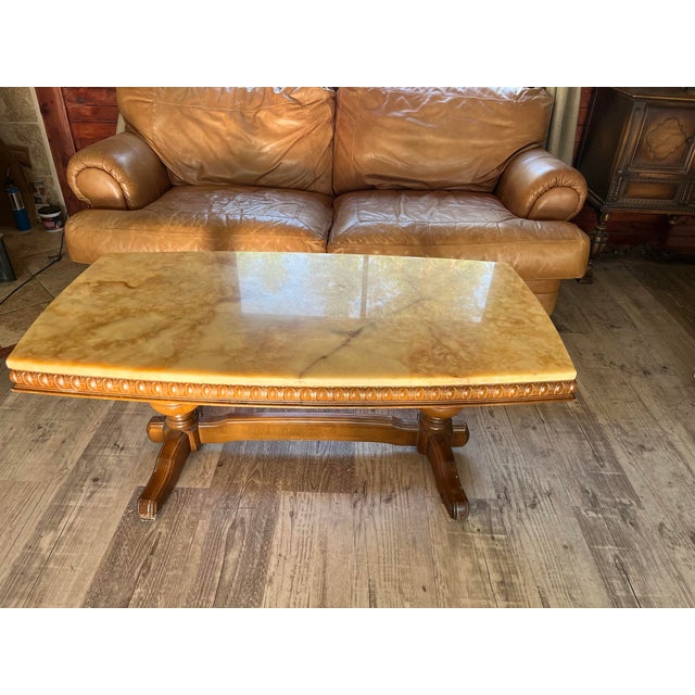 1960s Wilhelminian-Style Coffee Table Features a Polished Honey-Toned Onyx or Marble Slab Top Resting on an Ornately Carved Double-Pedestal Wooden Base For Sale - Image 5 of 12