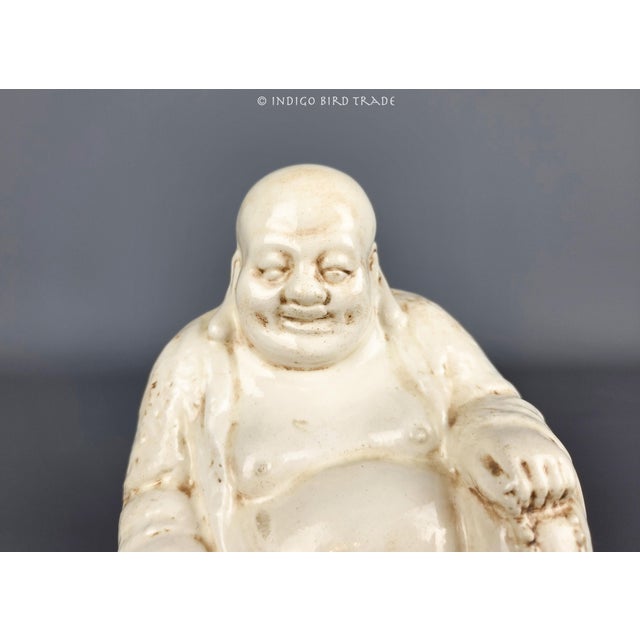 This sculpture is made from glazed off-white ceramic with accents. There is a maker's mark at the bottom "Eunice 1963"....