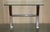We are delighted to offer this lovely, chrome tipped, x framed console table with bevelled edge glass top A very good...