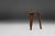 This rustic solid wooden tripod stool from 1940s France embodies the quiet beauty of vernacular craftsmanship at a moment...