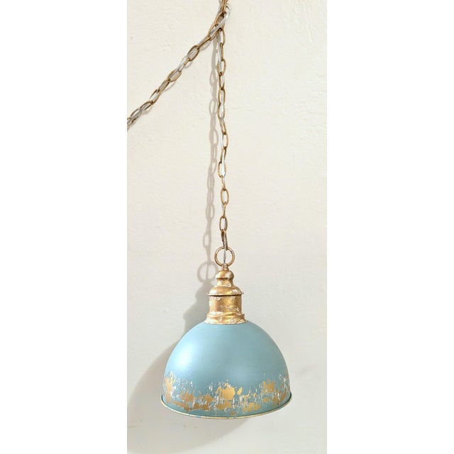 Add a touch of retro charm and modern elegance to your home with the Retro Blue Pendant Light. A heavily distressed,...