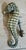An unusual antique British door knocker fashioned in the form of a seahorse, combining functional architectural hardware...