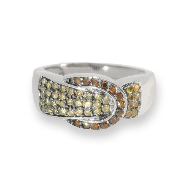 This exquisite estate ring features a unique belt buckle design crafted in 14K white gold. Adorned with 39 round champagne...