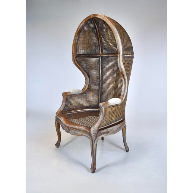 An exquisite vintage French Country / Louis XV style double caned canopy Porter's chair with hand painted faux distressed...