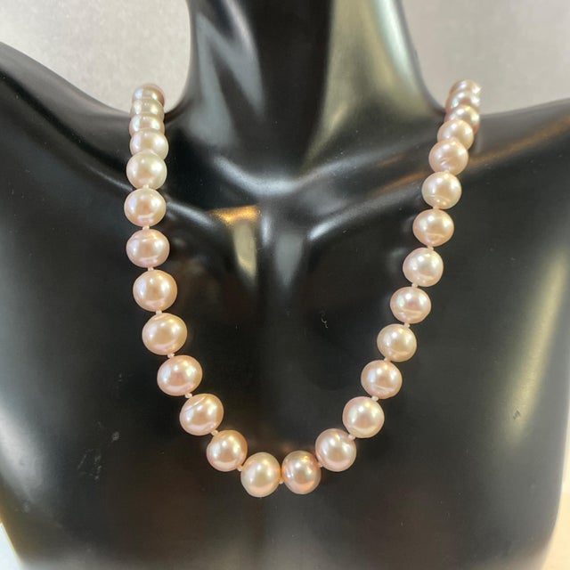 Indulge in the timeless elegance of our exquisite Pink Pearl Necklace, a stunning accessory that effortlessly elevates any...