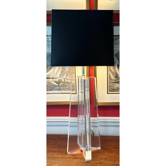Beautifully executed table/desk lamp in solid lucite and chrome hardware by Les Prismatiques, American 1970's. The cord is...