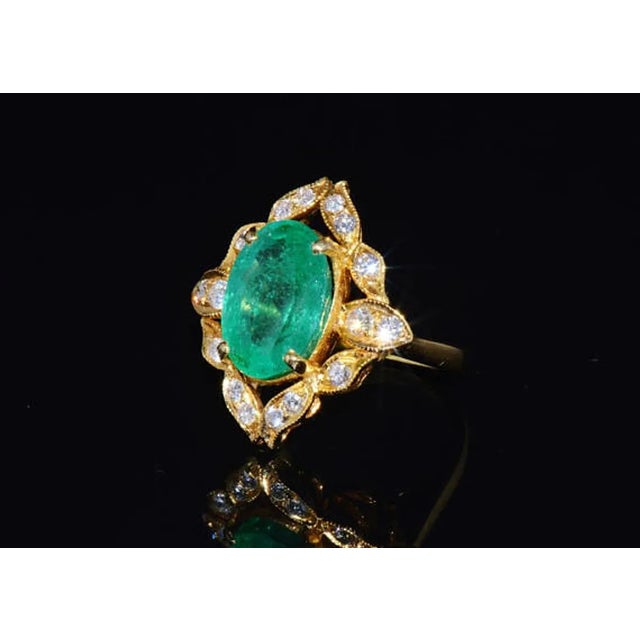GIA certified 6.89CTS diamond & emerald 18K solid gold ring. This ring features a huge 6.28CT natural Colombian emerald in...