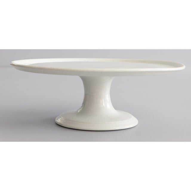 A gorgeous antique French white ironstone cake stand on a pedestal, circa 1890. No maker's mark. This gorgeous cake stand...