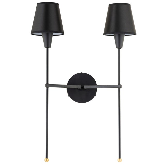 Elegant, tapered shades provide warmth and enhance the clean lines and refined polished brass details of our 2-light...