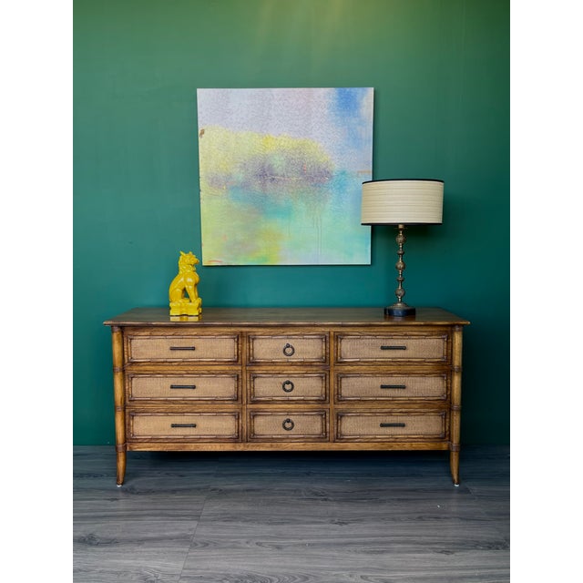 Mid-century faux Bamboo dresser of nine drawers This dresser in great vintage condition Dimensions: 65"Width x 19"Depth...