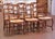 Bring authentic country charm to your dining room with this elegant set of six French Provincial chairs crafted in...