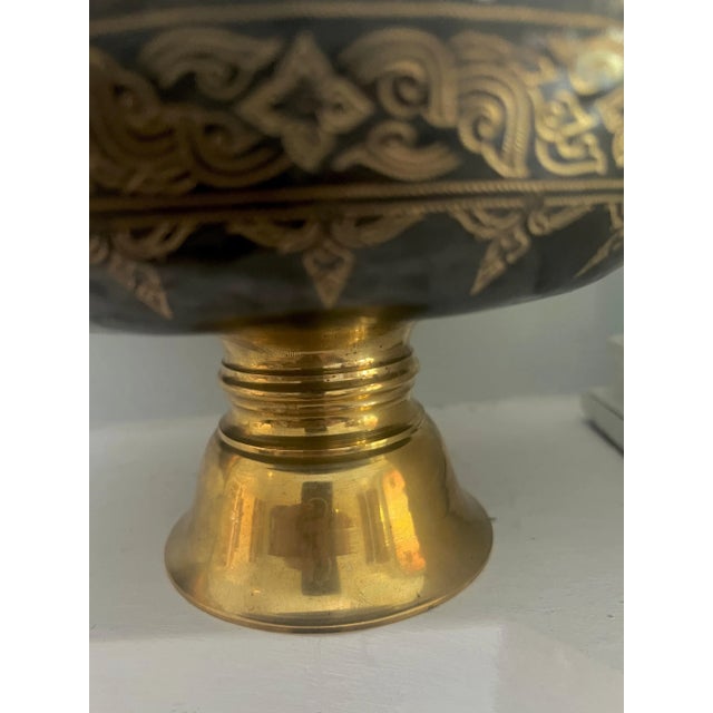 A stunning Brass footed bowl with intricate Etched Design in Gold. The foot is brass as in the inside of the bowl - very...