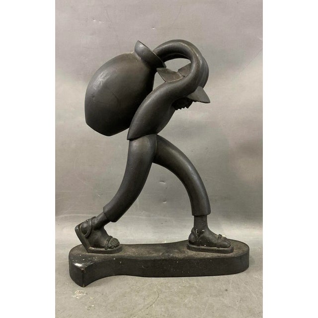 Powerful wood carving of a peasant farmer by celebrated Mexican artist José Pinal (1913–1983). Known for his expressive,...