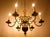 An elegant, smaller six-arm dutch-style chandelier made of bronze, suitable for both classic and period interiors. The...