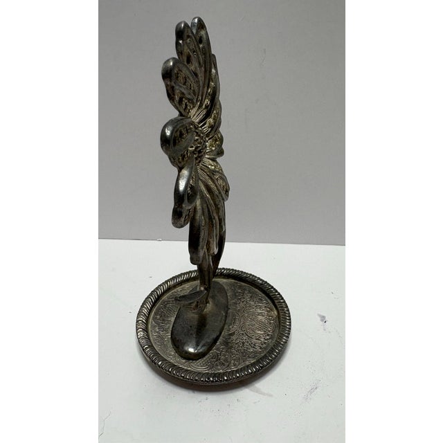 Vintage silver-tone metal flower figurine featuring a pierced daisy design with sculptural stem and engraved base. A...