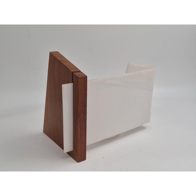 A pair of bed / wall lights with teak base and rectangular acrylic shades, midcentury modern, mid-1900s. Designed by yki...