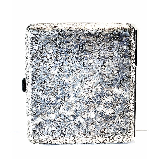 An amazing antique cigarette case of solid .950 sterling+. In a most extravagant all over scrolling ivy design. Its weight...