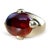 Circa 1970s Pomellato cocktail ring in 18K yellow gold, centered by a large oval cabochon hessonite garnet with a deep...
