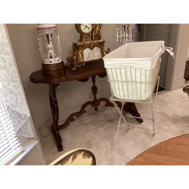 The Mid Century Metal Laundry Ironing Basket on Collapsible Frame is a stylish and functional household item perfect for...