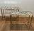 This magnificent pair of neoclassical-style side tables is made of brass with oxidized mirror tops. The base features a...