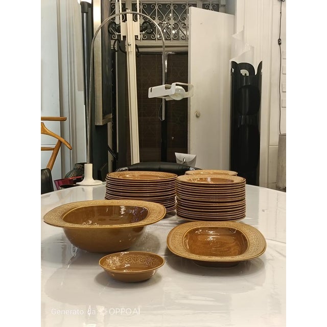 Rare and iconic glazed terracotta margherita table service designed by antonia campi for the italian company ceramiche...