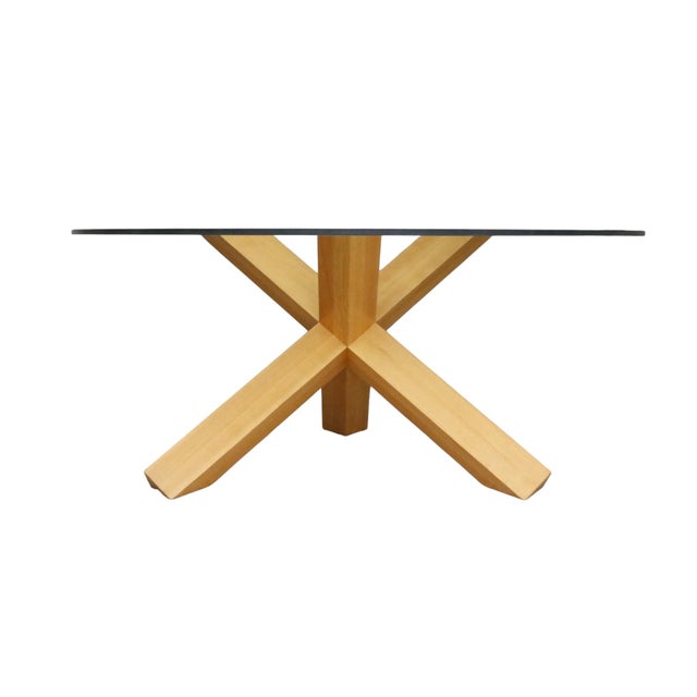 A La Rotunda Dining table attributed to designer Mario Bellini in 1976 for Cassina. A thick round glass top is supported...