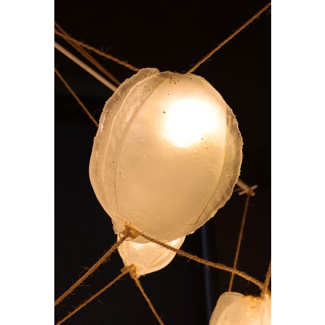 Illuminate your space with the exquisite Manolito & Manolito "Ouef de Selenite" Custom Blown Glass and Rope Chandelier, a...