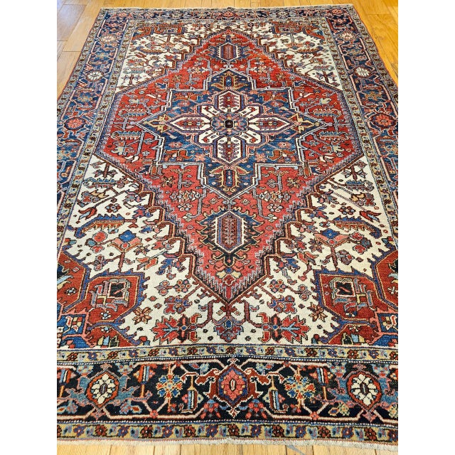 "This rare and desirable early 20th century Persian Heriz rug, dating from the first quarter of the 1900s, is uniquely...