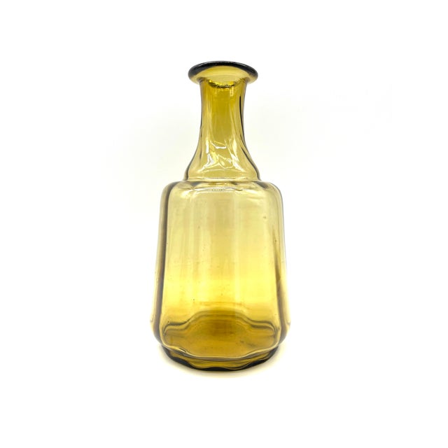 An exceptional and exquisite Swedish Mid-Century Modern glass vase (“Flaska”) in a warm amber hue, designed in the 1950s...