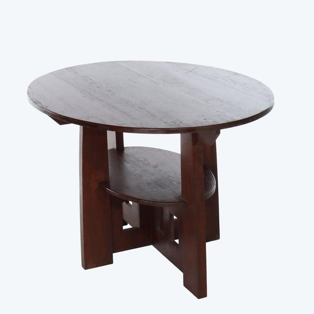 An exemplary piece of American Arts & Crafts furniture, this Mission oak double oval table is attributed to the esteemed...