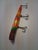 This item is a vintage, hand-painted, wooden pencil plug fishing lure, commonly used for targeting walleye or bass. It...