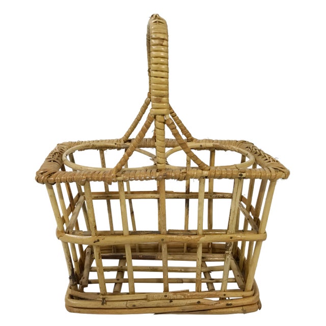 Lightweight wrapped rattan wine or utensil holder caddy. Secondary use as flower vase. A chic utilitarian piece! Sturdy....