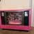 Authentic custom made and painted retro antique TV pet bed. Floral wallpaper has been added along with gray marble flooring.