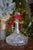 Hand-cut Polish lead crystal decanter featuring a wide baluster form, deep diamond and fan cutting, and a tall flared neck...