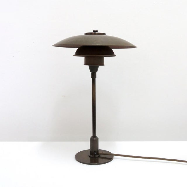 Rare Poul Henningsen. PH-3/2 table lamp with original copper shade set on a browned brass stem and shade holder with wire...