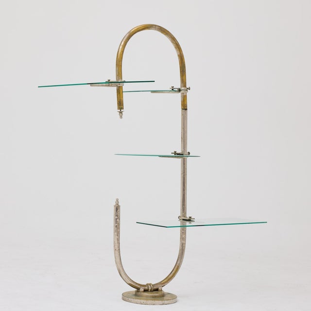 Exceptional early 20th-century freestanding display stand in metal and glass, originally used in a historic Modernista...