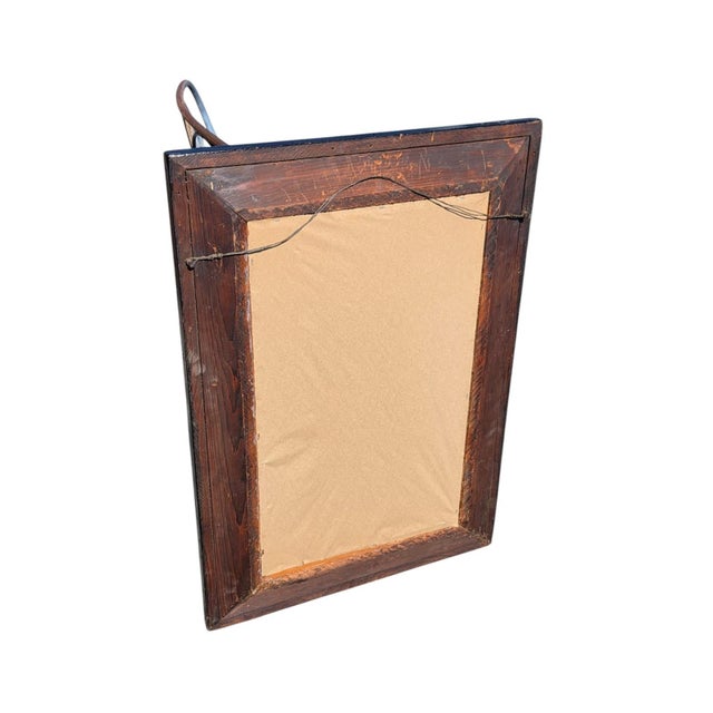 This product is a 19th century American mahogany Empire style wall mirror that has been refurbished. It features a...